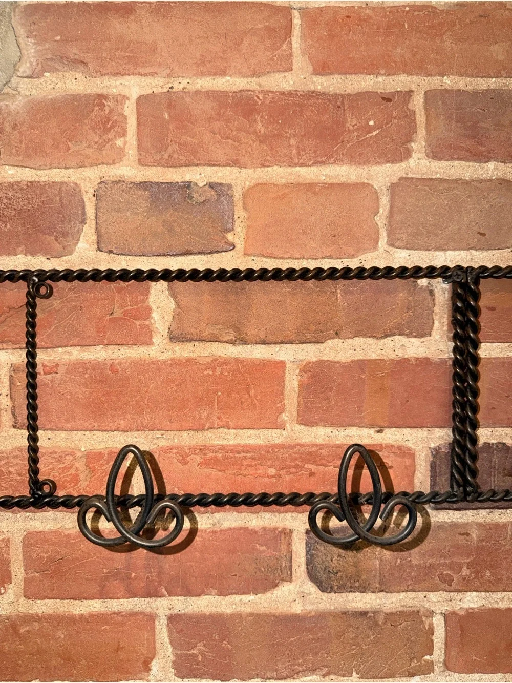 Ornate Black Metal Wall Hook Rack with Scroll Accents